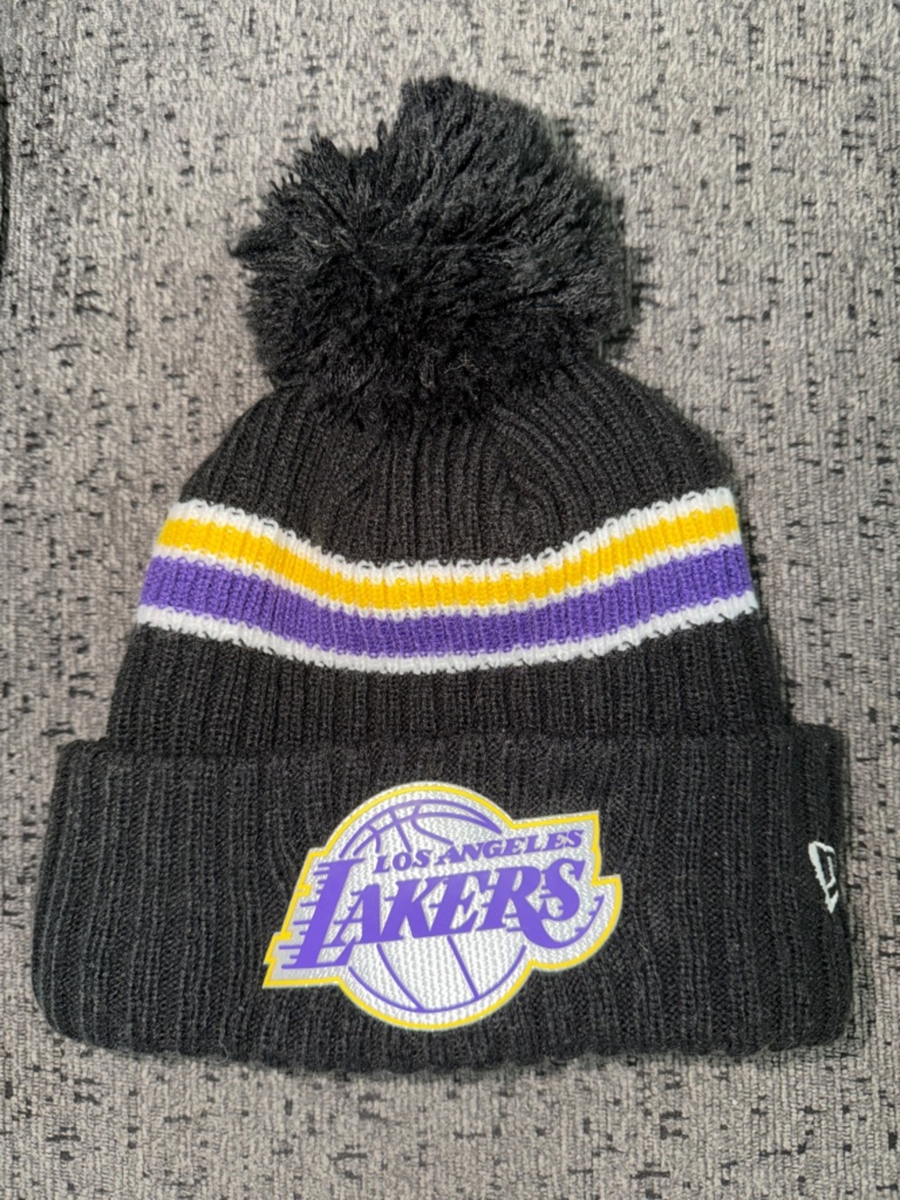 Los Angeles Lakers New Era Black Beanie with Purple & Gold Stripe and Pom